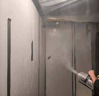 Smoke test verifying integrity of an asbestos enclosure